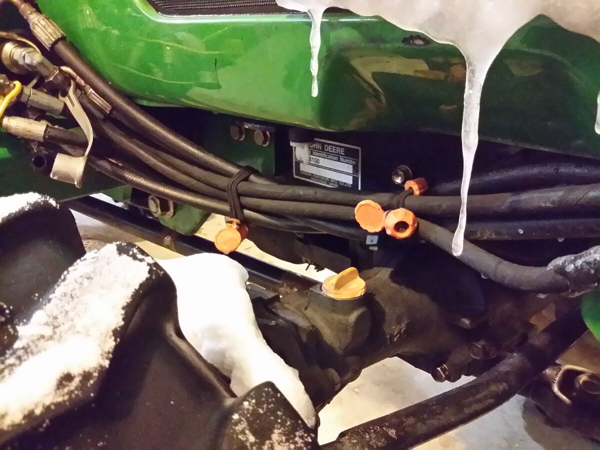 John Deere hydraulic hoses lashed