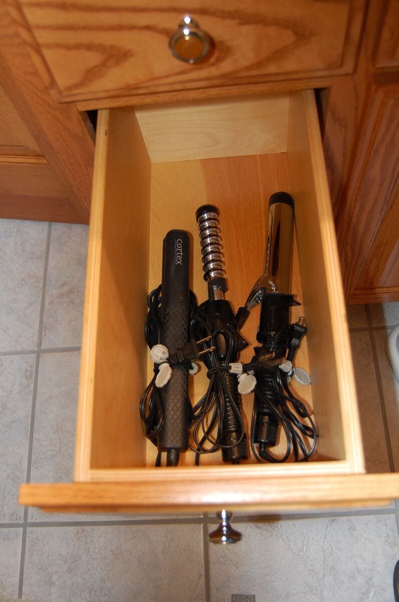 Hair tools cinched in drawer